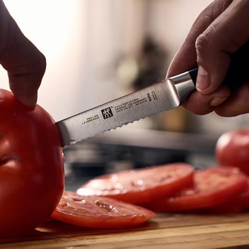 Image of ZWILLING Four Star 5-inch Razor-Sharp German Serrated Utility Knife, Made in Company-Owned German Factory with Special Formula Steel perfected for almost 300 Years, Dishwasher Safe