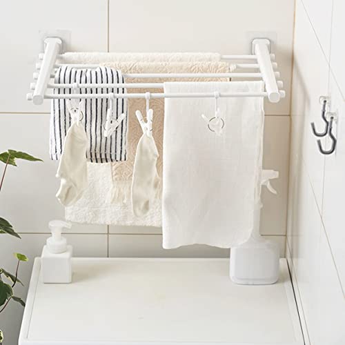 Étendoir vêtements pliable pour étendre sa lessive sur un cintre mural compact