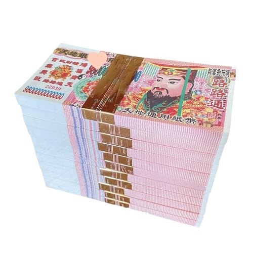 Offrandes de papier brûlé et pièces fantômes de yuans pour rituel funéraire
