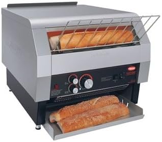 Hatco TQ-1800H Toast Qwik Conveyor Toaster with bread on the conveyor and in the crumb tray.