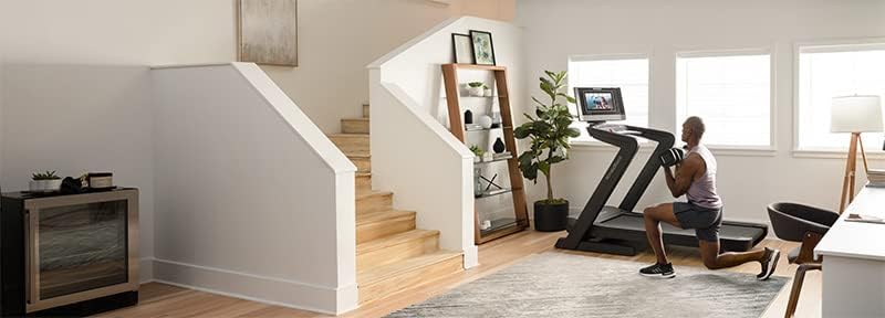 NordicTrack Commercial 1750 Treadmill in a home gym setting, partially folded