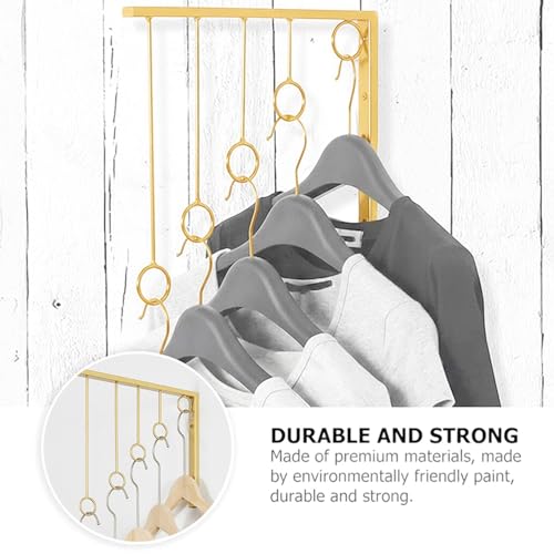 Perchas de ropa doradas de pared para organizar lencería sin ocupar espacio 5