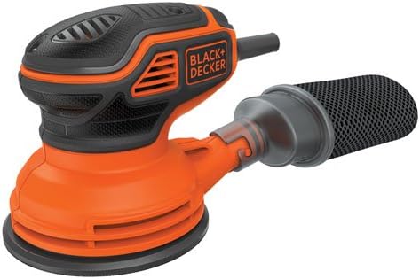 A BLACK+DECKER random orbit sander in use on a wooden surface, showing the sanding action.