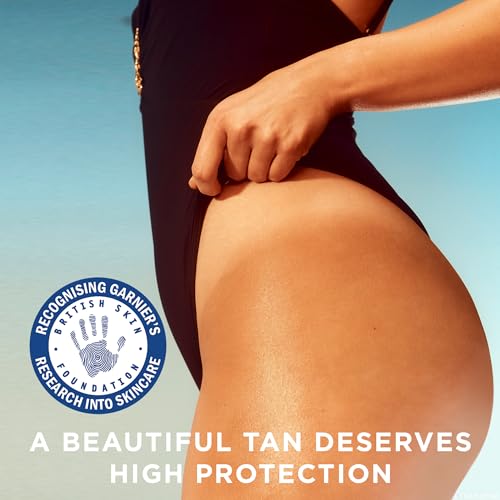 Garnier Ambre Solaire Sun Cream Spray SPF15, Ideal Bronze Protective Oil Sunscreen, Tan Enhancing, High Sun Protection Factor 15, Shea Butter, Water Resistant, Non-Greasy, UVA & UVB Protect150ml