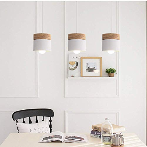 Lustre en bois massif pour éclairer chaleureusement votre salle à manger