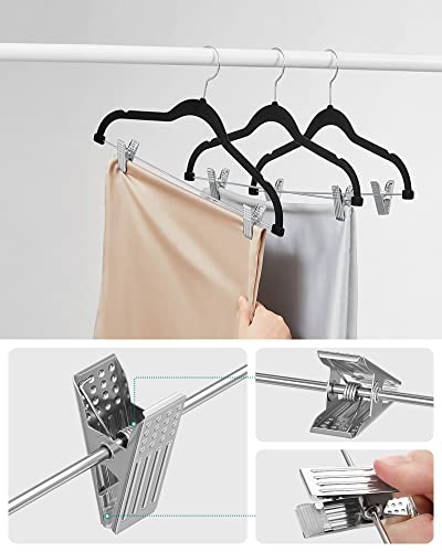 Image of SONGMICS Trouser Hangers, Set of 12 Velvet Hangers with Adjustable Clips, 42.5 cm Long, Non-Slip, Space-Saving, for Skirts, Coats, Dresses, Black CRF12B | Space Saving Hangers for Skirts and Trousers, Non-Slip, Adjustable Clips, Ink Black, BREANNA Collection CRF12B