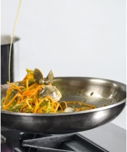 Close-up of food cooking on a gas burner