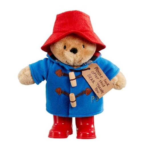 Rainbow Designs Classic Paddington Bear with Boots - 25cm Standing Plush Character - Soft & Cuddly Paddington Teddy Bear with Iconic Duffle Coat, Bush Hat & Shiny Red