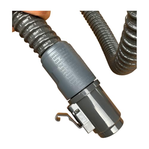 canister vacuum cleaner hose in use