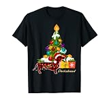 Perro salchicha con sombrero Santa Claus Decoración del árbol de Navidad 2021 Camiseta