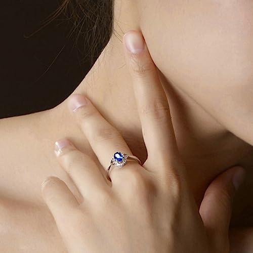 Bague en Argent 925 d'exception ornée d'une zircone bleue ovale et de cœurs