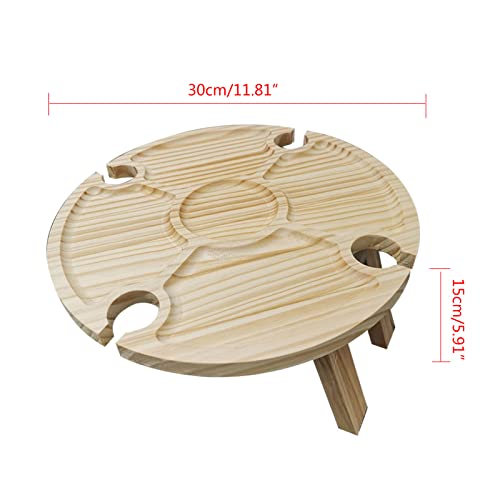 Table de pique-nique pliante en bois contre le sable sur la plage