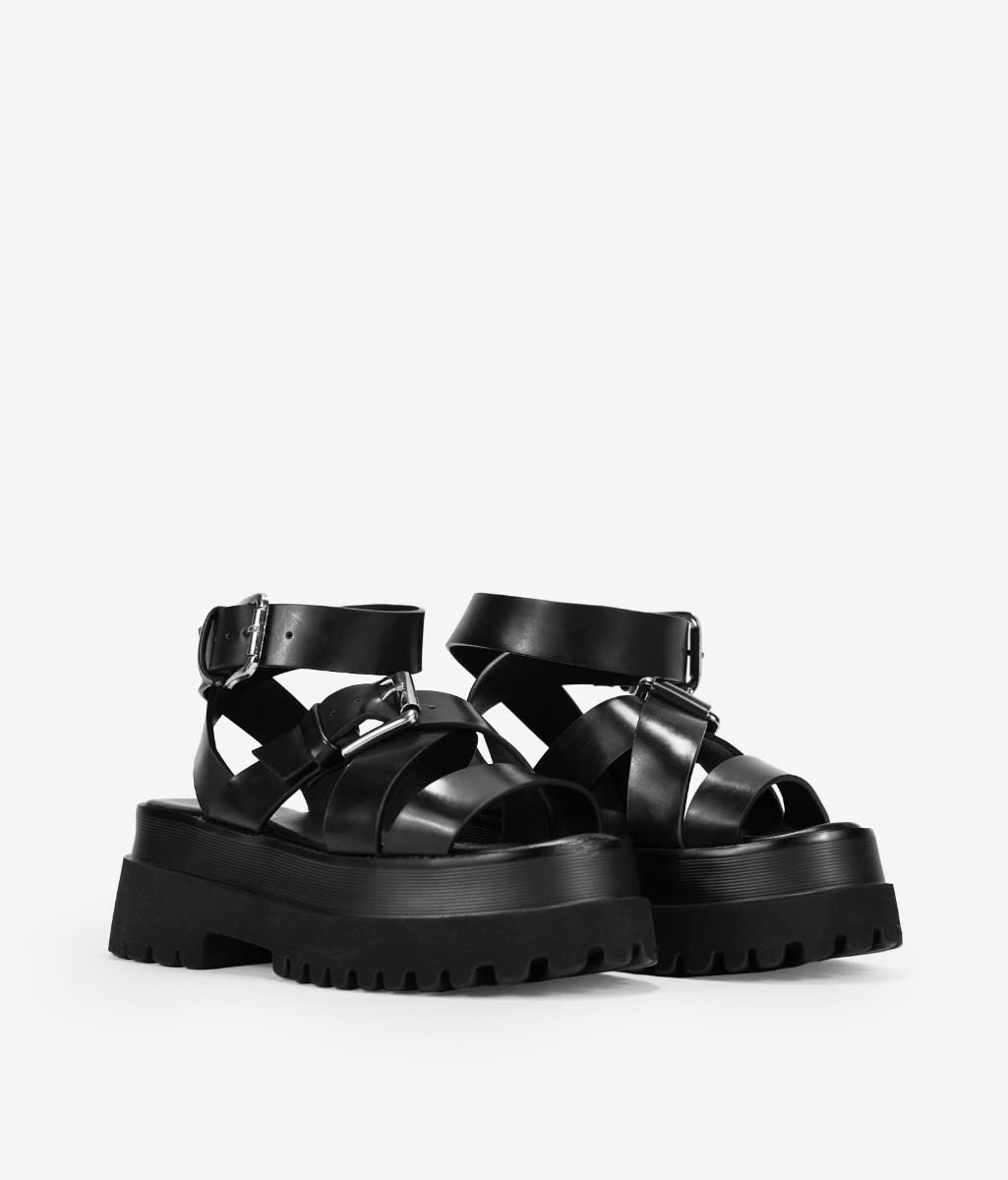 BOSANOVA Sandalias con Total Look Negro compuestas por Tiras Cruzadas al Empeine, Detalle de Hebilla Regulable y Suela Track de 6,5 cm. Cierre con Hebilla. Calzado para Mujer