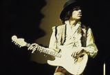 Title: Jimi Hendrix performing on stage in 1968