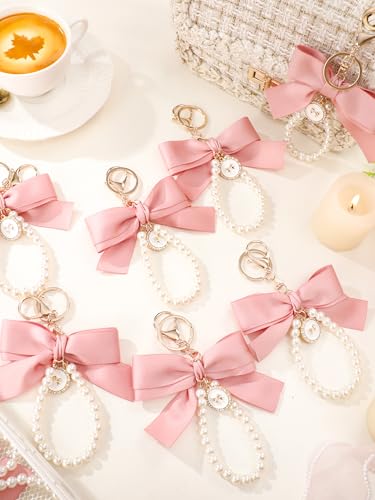 Image of Sureio Pink Bow Keychain Coquette Pearl Bowknot Keyring Bulk Wristlet Keychain Vintage Ribbon Purse Charm for Women Handbags