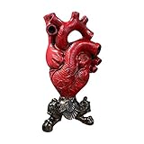 Die Skulptur des menschlichen Herzens macht die Menschen das Gefühl, dass Blumen und Pflanzen noch lebendig sind. Wir müssen uns gut auf alle Pflanzen aufpassen und mit unseren Herzen trinken.