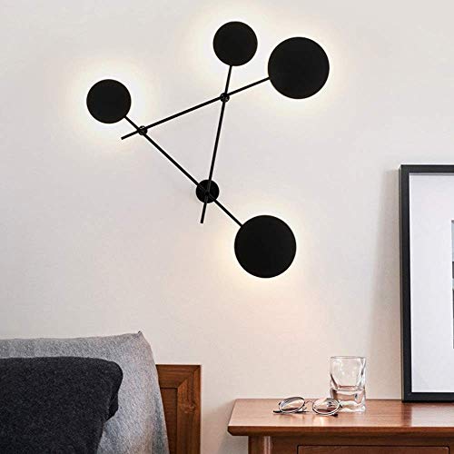 Lampe décoration haut goût avec cette applique murale ronde noire au design épuré