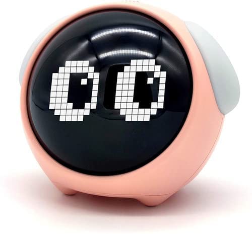 Pink and white Emoji Alarm Clocks with night lights illuminated in a dark room