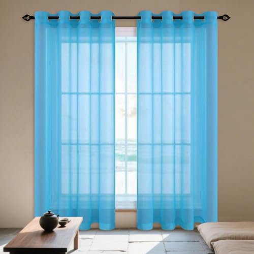 Voilages à oeillets contre la chaleur et les reflets du soleil