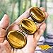 Obilea Gems - Tiger Eye Oval Thumb Worry Stone - Healing Crystals for Anxiety & Worry Relief, Calming, Meditation, Reiki with Gemstone Info Card & Premium Bag - Reiki Enhanced