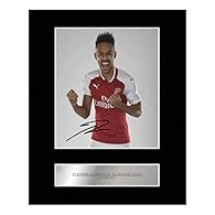 Pierre-Emerick Aubameyang Signed Mounted Photo Display Professionally mounted 10x8 inch Photo display with caption. Perfect gift, ready to be framed. High quality photographic print applied to a 1.5mm thick black bevelled mount. The autographs are pr...