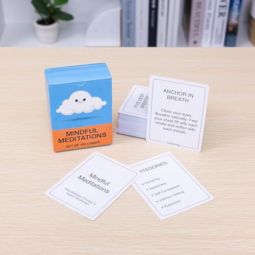Mindful meditation cards on a desk with a blue and orange card box in the background.