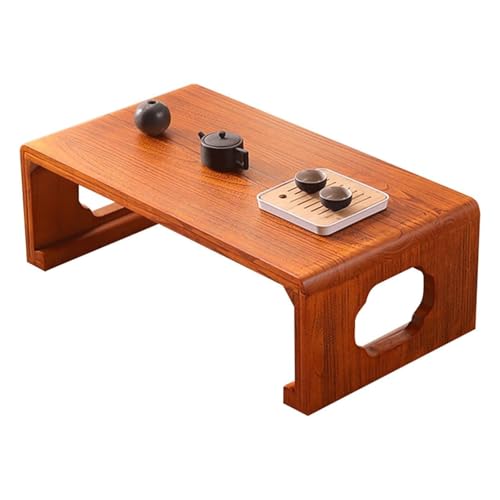 Table basse pour baie vitrée créant un coin thé et méditation chaleureux