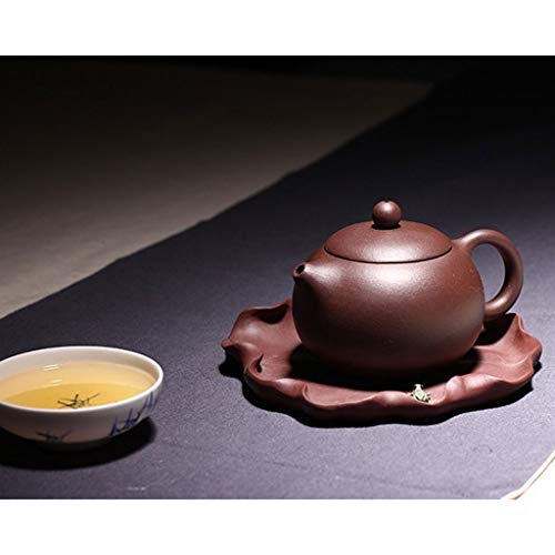 Tetera de cerámica marrón con filtro artesanal que evita hojas sueltas en tu té 8