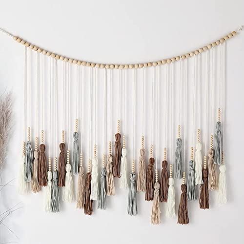 Tenture murale macramé marron et gris pour créer un coin lecture cosy et apaisant dans la chambre