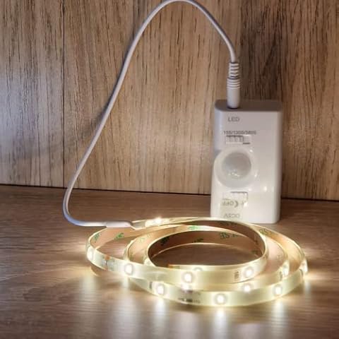 JANDEI - LED Strip Lights with Motion Sensor, USB Rechargeable, 1 Meter Flexible and Adhesive led Strip for cabinets, Drawers, Kitchen Furniture, Stairs (Warm Light) Cover