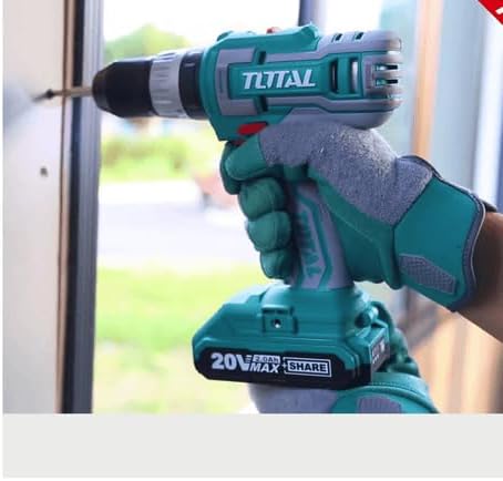 Person using the TOTAL cordless impact drill