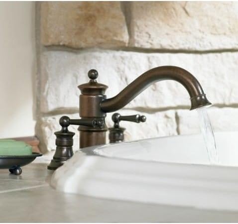 Close-up of the Moen Waterhill Kitchen Faucet in Oil Rubbed Bronze, showing water flowing from the spout.