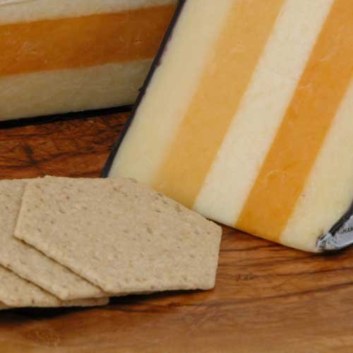 Saxonshires English Cheese - Half Moon (4.5 pound) - This Royal British Cheese is Made Layered with the following cheeses: Double Gloucester, Caerphilly, Cheshire, Leicester, and Cheddar.