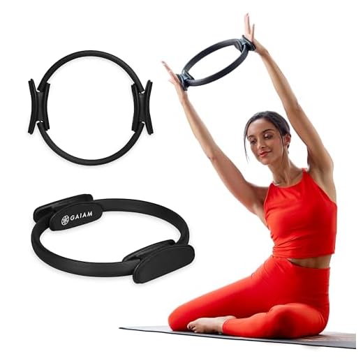 Gaiam Pilates Ring 15" Fitness Circle - Lightweight & Durable Foam Padded Handles | Flexible Resistance Exercise Equipment for Toning Arms, Thighs/Legs & Core, Black