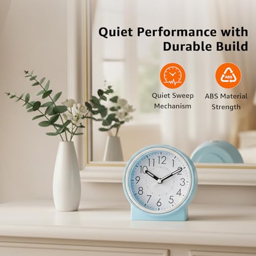 Image of Amazon Basics Analog Table Clock with Alarm and Snooze, Silent Operation, Manual Brightness, ABS, Light Blue, Battery Operated Design for Home, Desk or Office Use (Size: 11.5 x 12.4 x 5.4 cm)