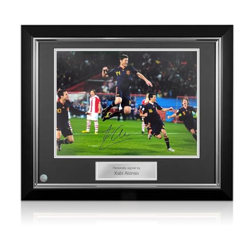 Exclusive Memorabilia Xabi Alonso Signed Spain Soccer Photo: 2010 World Cup Goal. Deluxe Frame
