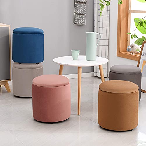 Pouf de rangement rond vert pour optimiser une petite entrée encombrée