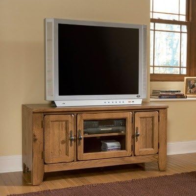 Broyhill Attic Heirlooms Entertainment Console with a television on top