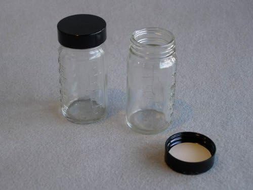 Round Glass Bottle, 4 oz. (clear) w/ black phenolic cap (288 per case)