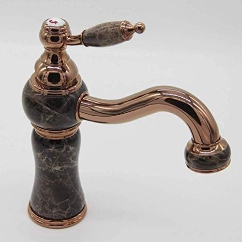 Robinet d'évier or rose et marbre un mitigeur de salle de bain haut de gamme