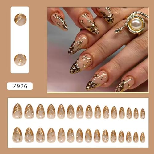 Image of Gold Press on Nails Short Almond Fake Nails French Tip False Nail With 3D Gold Irregularity Chrome Design Nude Glue on Nails Glossy Acrylic Full Cover Star Moon Stick on Nail for Women 24Pcs