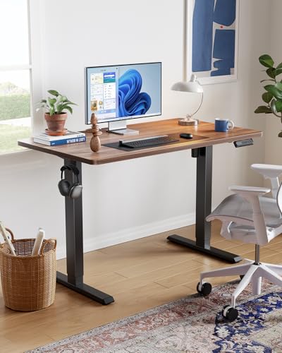HUANUO 55" x 28" Electric Standing Desk Adjustable Height, 4 Memory Height Settings, Headphone Hook, Cable Manager, Sit Stand Up Desk for Home Office & Computer Workstation, Walnut