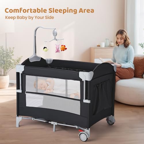Image of JOYMOR 5-in-1 Pack and Play with Bassinet and Changing Table, Lightweight Travel Crib, Foldable Baby Playard, Waterproof Changing Top, Carry Bag & Wheels