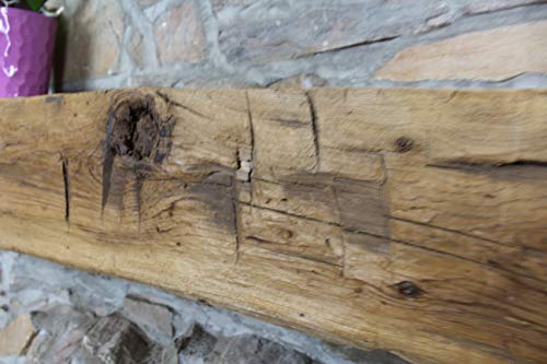 Close-up of the rustic texture of the hand hewn wood mantel