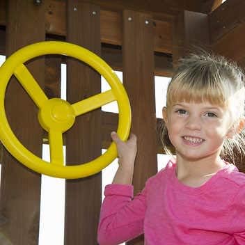 Child with playset steering wheel