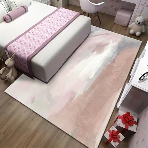 Tapis chambre ado rose au design abstrait pour coin petit canapé