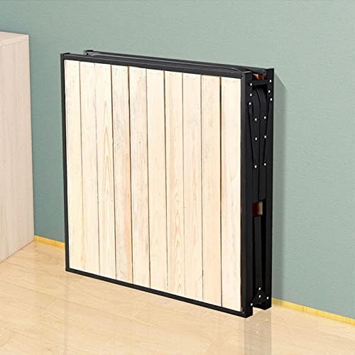 The bed frame folded compactly and stored upright against a wall.