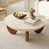Design moderne sophistiqué : la table basse ronde en béton homary dispose d'une finition unique en ciment sable du désert et d'une base sculpturale, ajoutant une touche organique et élégante à votre décoration de salon.