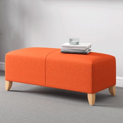 Banc ottoman vert pour optimiser l'espace du salon à la chambre