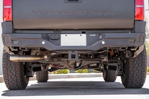 Image of DV8 Rear Shock & Link Skid Plates for 24-26 Toyota Tacoma | Protects Lower Shock Mount & Link | Built-in Drain Holes | Single Piece Design | Fully Bolt-On Installation | Black Powder Coat | 4mm Steel
